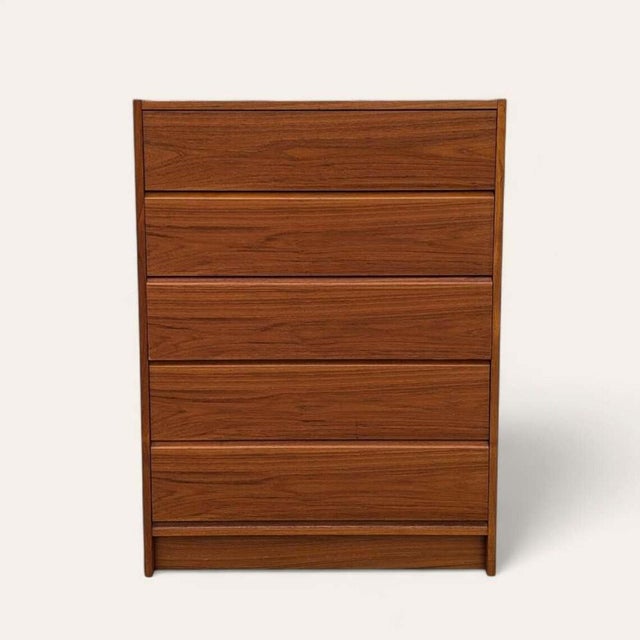 Bring timeless design into your home with this Danish Mid-Century Modern tallboy dresser in rich teak. Design: Embodying...