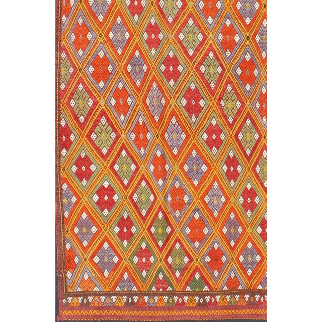 Vintage Turkish Embroidered Jijim Kilim With All-Over Diamond Design in Bright Colors Measures: 5'6'' x 9'0''. Featuring...