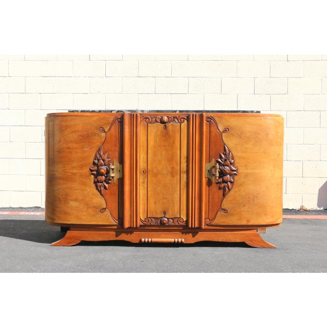 Striking Antique French Art Deco sideboard or buffet, beautifully crafted with rich burl wood veneer and topped with an...