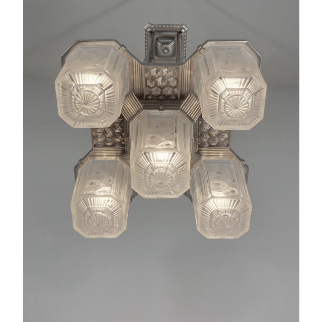 Hettier & Vincent A French art deco chandelier by Hettier & Vincent in nickel plated bronze. Around 1930. The fixture...
