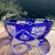 An exceedingly elegant small cobalt cut to clear console bowl. It has a notched rim, circle and vertical bar motifs, and a...