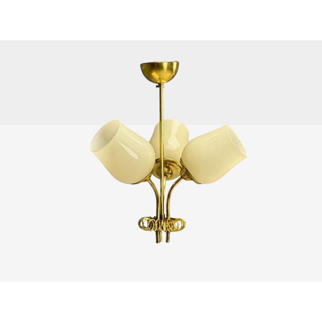 Itsu, Finnish Mid-Century Modern, Pendant Light, Opal Glass, Finland, 1940s A three arm pendant light designed and...