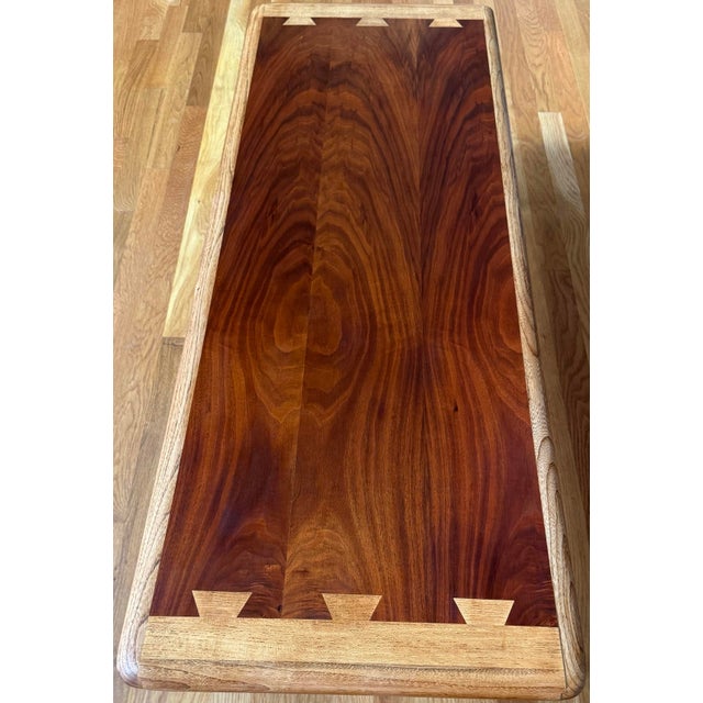 Classic MCM piece Walnut with oak veneers and oak solids, warm brown tones Dovetail detailing Bullnose edge Tapered black...