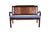 A Mid-Century Modern Loveseat featuring carved teak, satinwood and rosewood with caned seats. Caning is redone in a...