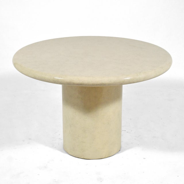 This lovely table covered in a faux parchment finish is scaled to serve either as a center table or a dinette table. 29"h...