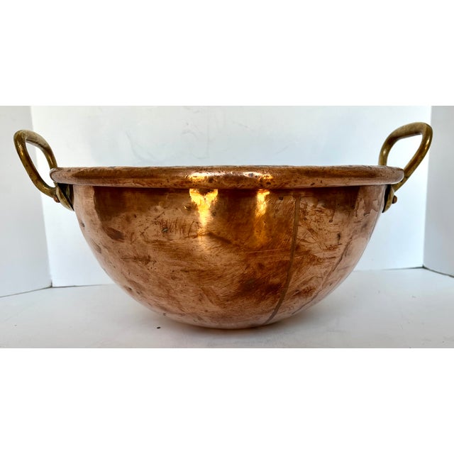 Imported from France. Very heavy handcrafted copper mixing bowl. Thick turned lip on the edge. Brass handles. Priceless...