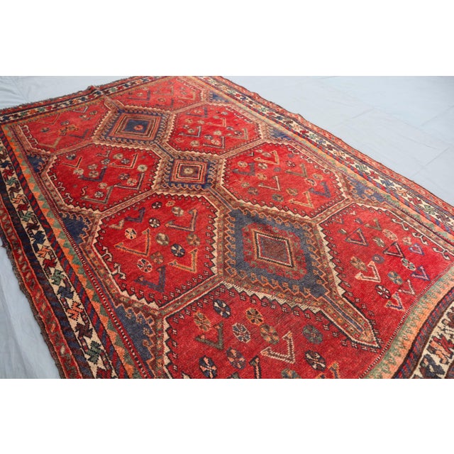 This vintage handmade persian tribal rug is a stunning example of mid-20th century craftsmanship, dating back to the...
