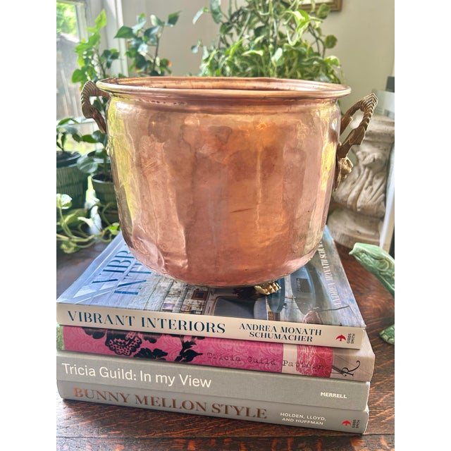 This hammered copper jardinere or cache pot hails from the early 20th century and has that soft patina that only age can...