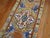 A colorful Turkish Anatolian runner from the middle of the 20th century. A formal palette with intense colors on a camel...