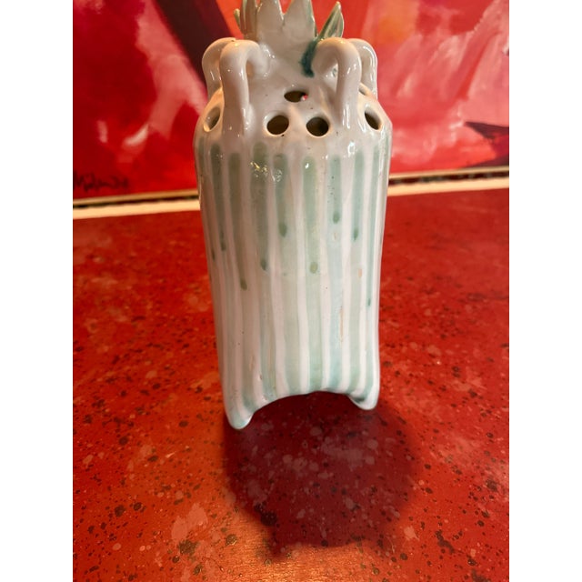 Handmade by a master potter. One of a kind flower vase with celadon green stripes