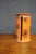 Handcrafted stoneware paper towel holder by David T. Smith, featuring a cylindrical form with a fitted lid, warm burnt-...