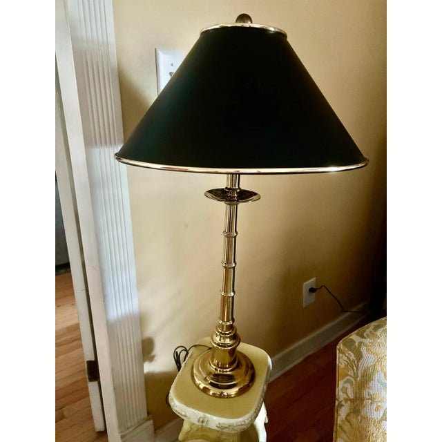 Lovely brass bamboo table lamp with stunning black shade with brass piping and decorative interior of shade. The lamp...