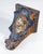 Sculpted and painted terracotta shelf with a woman's face and neoclassical-style decorations. 19th century period 19th...