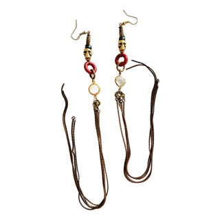 Vintage 1990s Gothic Tribal Brass Skull Shoulder Duster Earrings, Pair For Sale