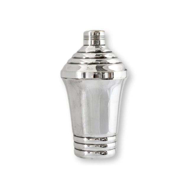Early 20th century French silverplate cocktail shaker with streamlined Art Deco styling and stepped geometric detailing....