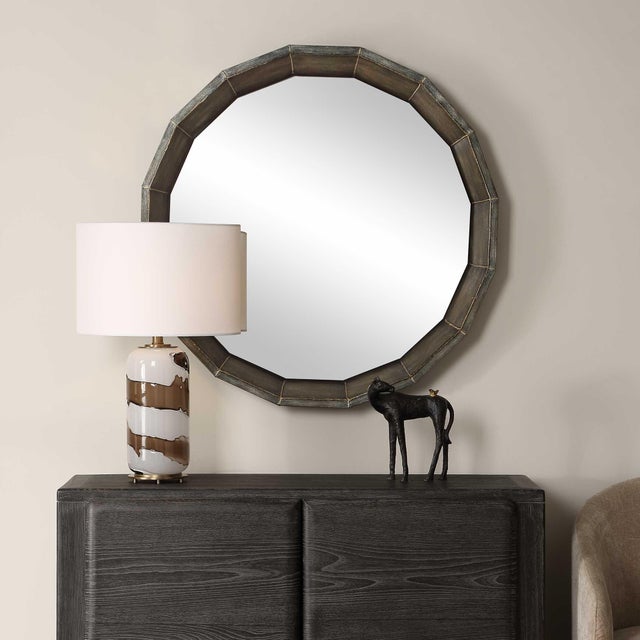This Distinctive Mirror Features A Unique Faceted Frame, Finished In A Rich Rubbed Bronze With Exposed Welded Edges,...
