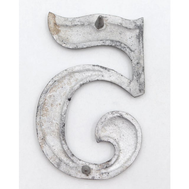 Vintage brushed aluminum numeral 5 outdoor house or building marker with two prongs on the back. Good condition with...