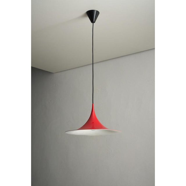 Iconic "Semi" pendant light, created in 1968 by architects Claus Bonderup and Torsten Thorup. Produced by Fog & Mørup,...