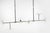 Ian K. Fowler for Visual Comfort Signature Calvino Large Linear Chandelier in Aged Iron & Hand-Rubbed Antique Brass with Clear Glass For Sale In Houston - Image 6 of 7