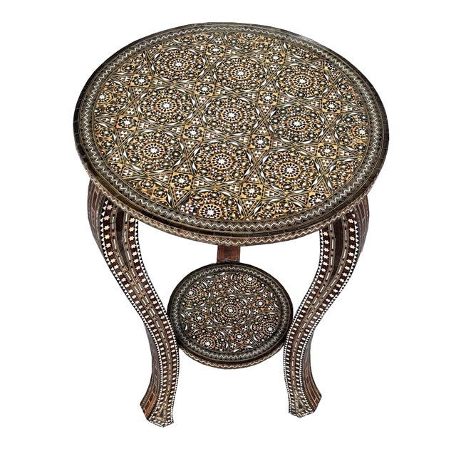 Elegant vintage round-top side table dating to circa 1940, featuring an exceptionally fine and intricate natural wood...