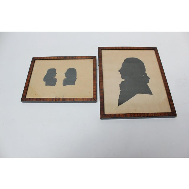 Set of two early silhouette portraits dated 1787 and 1782, respectively, by unknown maker in nice period tiger maple...