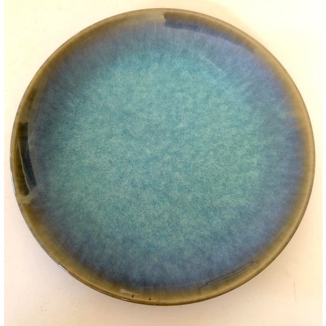 Beautiful set of the Japanese tradition of five ceramic plates in a lovely blue glaze with black glaze underneath. Makers...