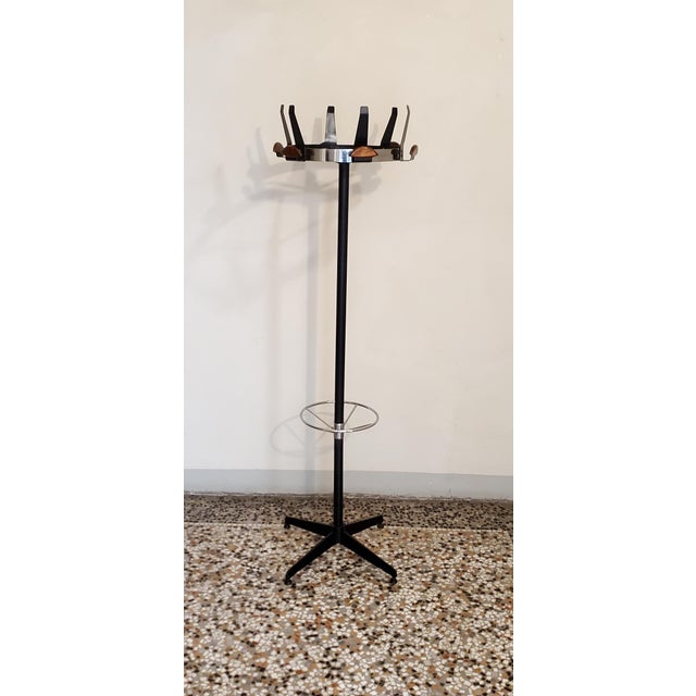 1960s coat rack, Italian-made in iron and wood, these classic lines from 1960s Italy can also be considered a form of...