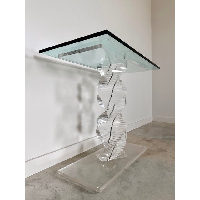 This stunning 1980s modern console table is a true testament to the era’s bold, innovative design. The table features a...