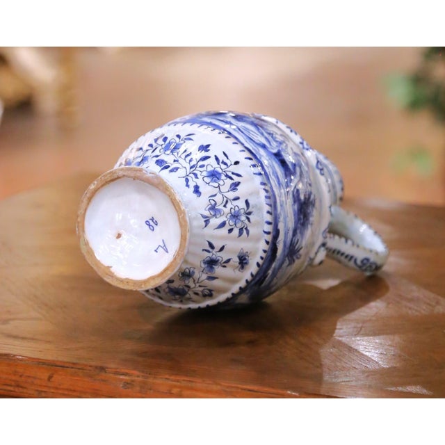 19th Century French Blue and White Faience Ewer With Courting Scene For Sale - Image 10 of 11