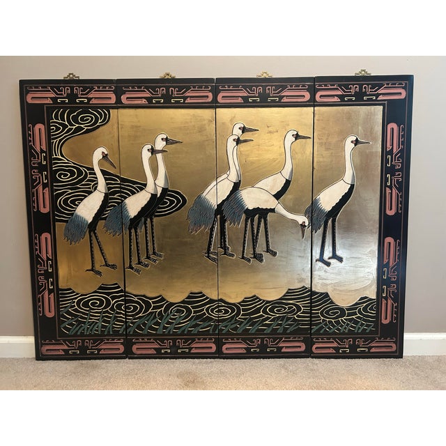 A striking vintage 4-panel Chinese export Coromandel-style screen featuring a dramatic and richly rendered scene of...