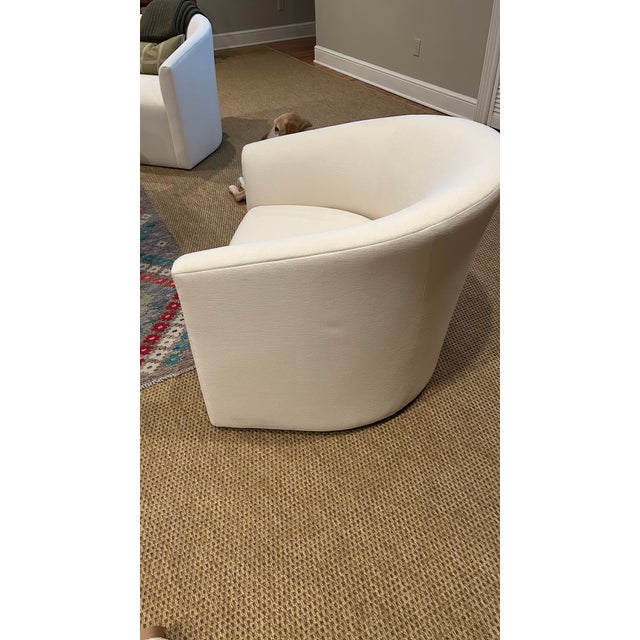 a pair of arrondi swivel chairs from restoration hardware in natural linen weave fabric. a modern touch to any room, these...