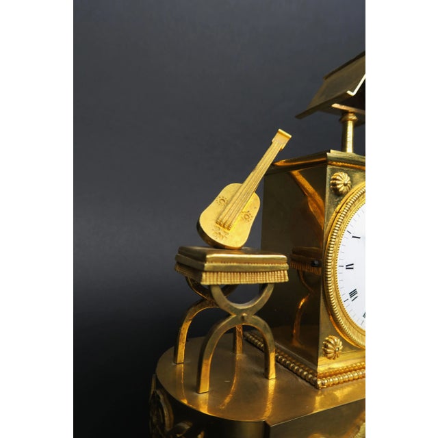 A Troubadour Clock / Directoire Gilt Bronze Clock, Circa 1800 The clock depicts a troubadour, or medieval musician,...