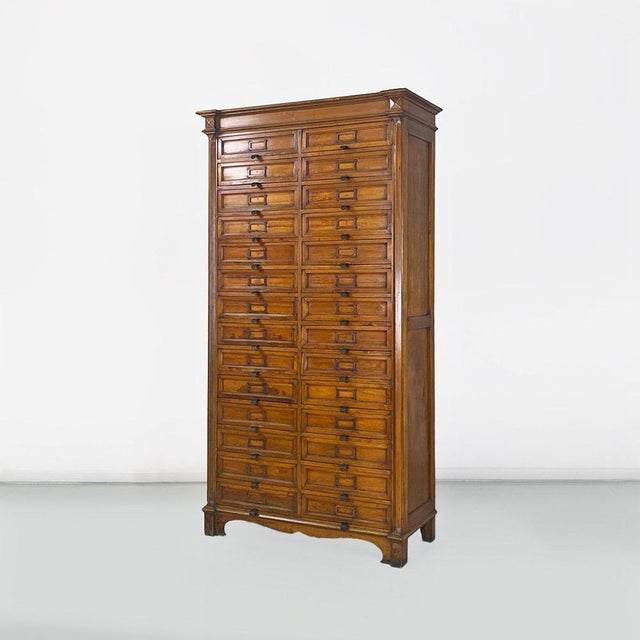 Mobile archive of walnut wood office with double column of drawers with brass details. 1940 ca. Good conditions. Measures...