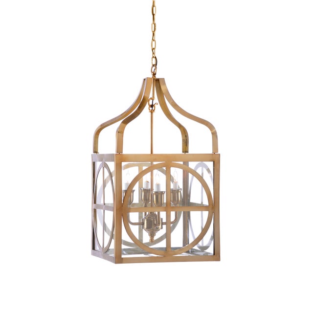 This is the Sherman lantern by Wildwood Lamps. The piece features a brass finish.