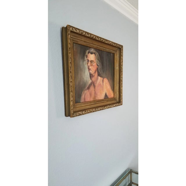 Here is a vintage artist study oil portrait painting of a nude male with long hair and glasses. It is executed in a loose...