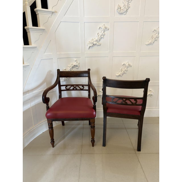 Pair of antique George III quality mahogany desk chairs having a quality mahogany top, carved mahogany centre splat,...