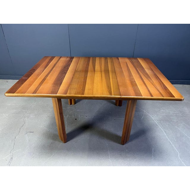 Gorgeous wooden dining table by Molteni in the style of Tobia Scarpa. Greta looking wooden top with 4 sturdy legs. The...