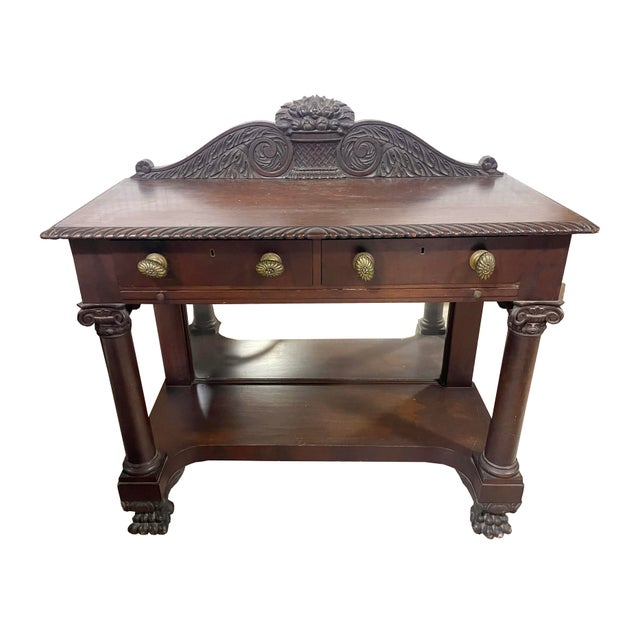 Antique Empire (mid-late 1800s) sidebar with a leather-topped pullout serving/desk surface and mirrored underside....