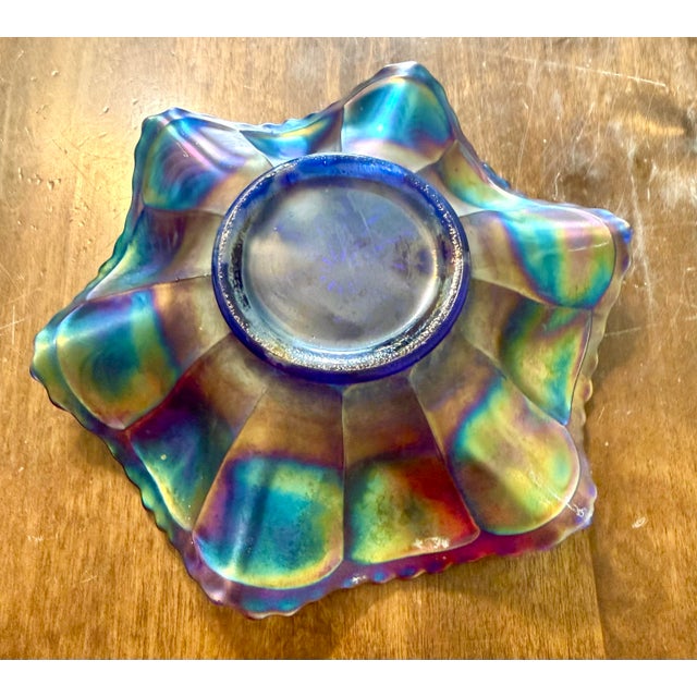 This Fenton piece is a classic example of antique Carnival glass with an iridescent “oil finish”. It has a multi-colored...