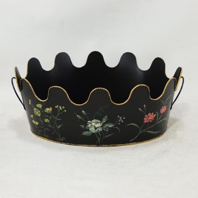 This charming vintage toleware planter features a classic oval silhouette crafted from durable metal with a distinctive,...