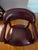 4 Office chairs in excellent condition. Burgundy leather with nailhead trim on casters to facilitate movement in your...