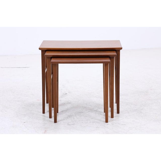 Vintage nesting tables with clean lines and pleasantly rounded edges. The three tables can be nested together to save...