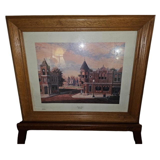 A nostalgic vintage print titled Saturday Morning by Randy Souders, dated 1985. This charming Americana scene captures a...