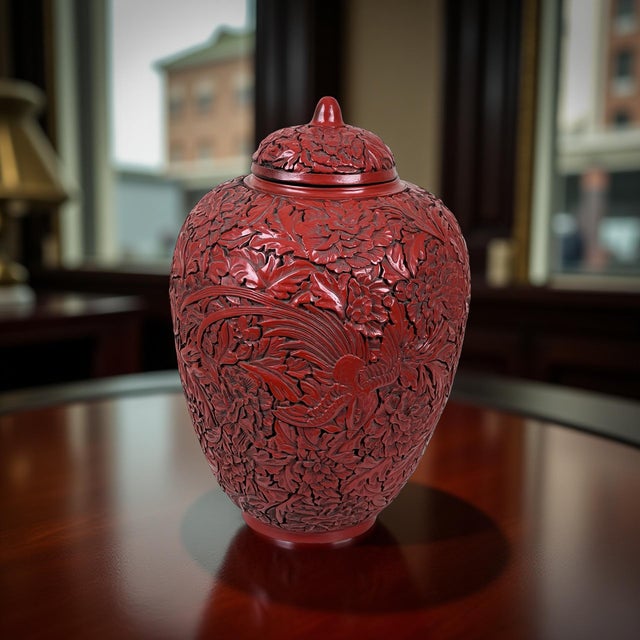 This exceptional antique Chinese cinnabar lacquer jar is richly hand-carved in deep relief, displaying the extraordinary...