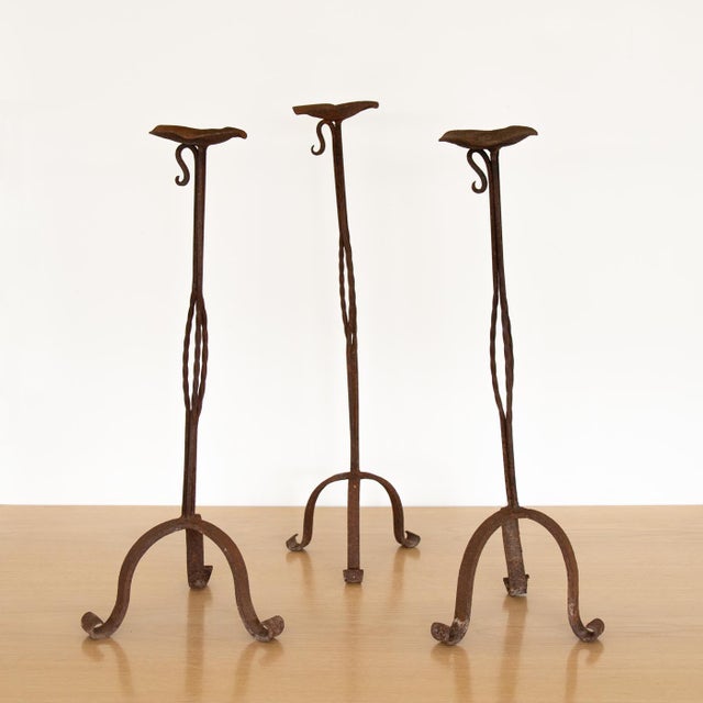 Tall vintage iron candlestick from France, 1940's. Tripod base with twisted stem detail. Iron shows nice age, patina, and...