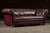 English Mid 20th Century Deep Oxblood Leather Chesterfield Sofa With Nailhead Trim For Sale - Image 3 of 12