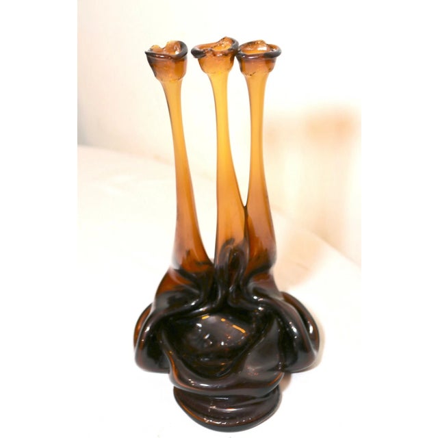 Up for sale is a wonderful vintage hand blown candelabra sculpture made of old beer bottles. It's blown out of three amber...