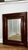 This striking 19th-century antique wall mirror features a classic Empire / Ogee mahogany veneer frame with rich grain and...