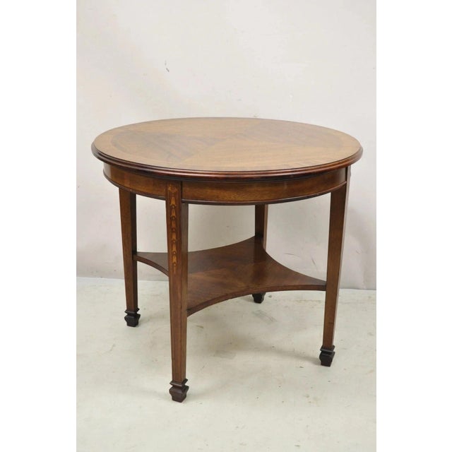 Antique English Edwardian Mahogany Bellflower Inlay Round Occasional Side Table. Item features a sunburst inlay top,...