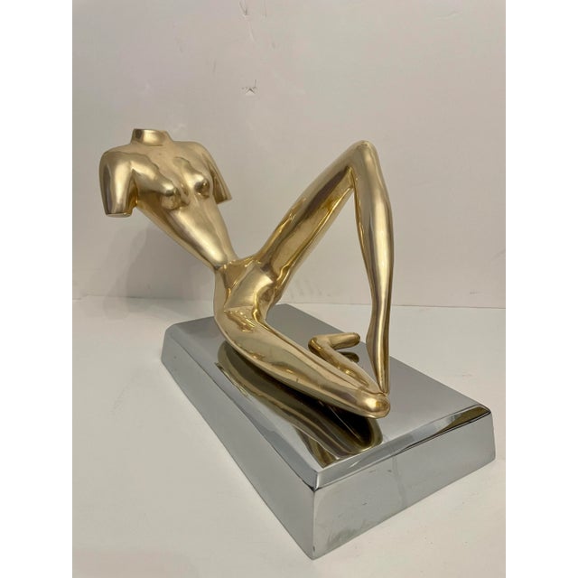 A very good quality decorative midcentury large reclining nude brass figural sculpture on cast, thick, beveled aluminum...